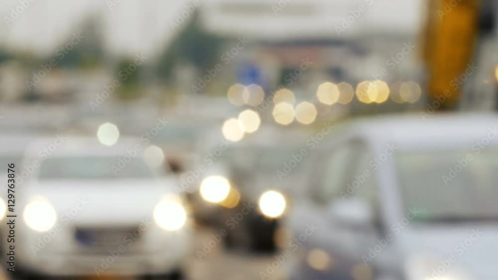 Blurry. unfocused clip of heavy urban traffic. including cars. buses and other vehicles. on a busy thoroughfare. with bokeh effect lights. Blurry. unfocused clip of heavy urban traffic. including cars. buses and other vehicles. on a busy thoroughfare. with bokeh effect lights.