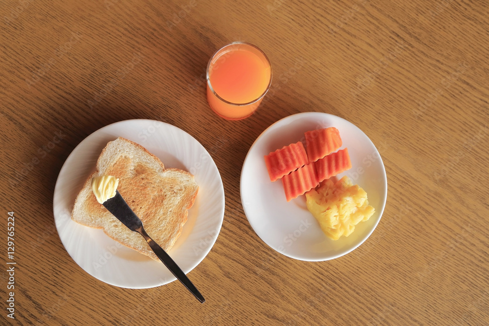 Set of breakfast, plate of toast with butter and fresh fruit and Set of breakfast, plate of toast with butter and fresh fruit and