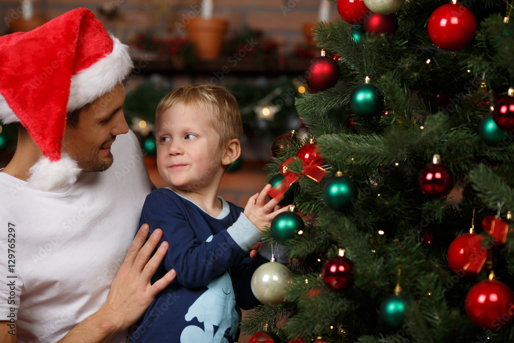 Loving father, son near tree Loving father, son near tree