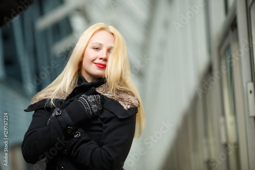 Smiling girl in black coat