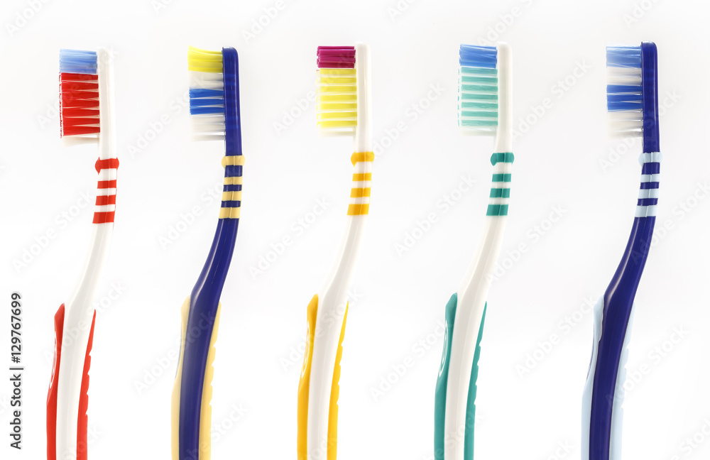Colorful toothbrushes on a white background Colorful toothbrushes on a white background