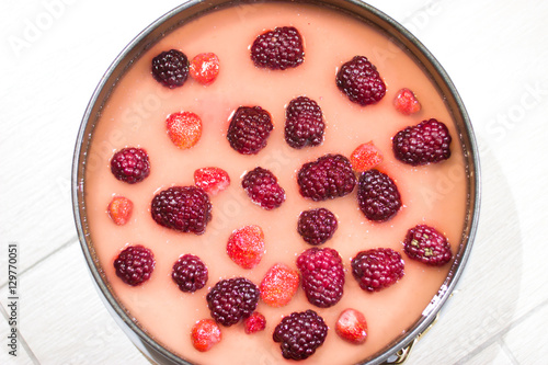 Cooking berry cheesecake.