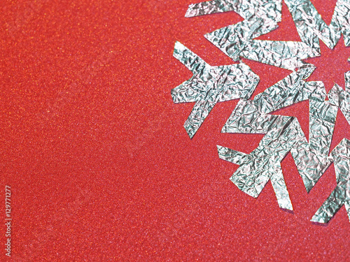 foil snowflake on a red background