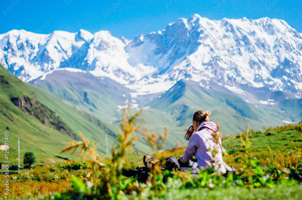 Traveling backpacker girl enjoying Caucasus Mountains in Svaneti, Georgia