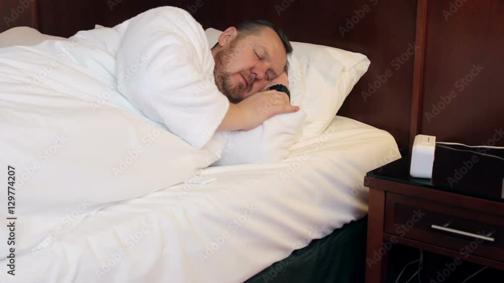 morning at the hotel. awakened by a man breaks the electronic alarm clock morning at the hotel. awakened by a man breaks the electronic alarm clock