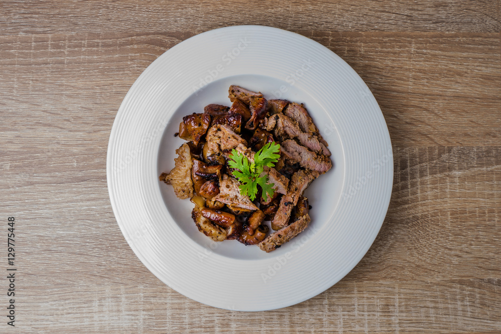 Grill pork on wooden table. (Thai style food) Grill pork on wooden table. (Thai style food)