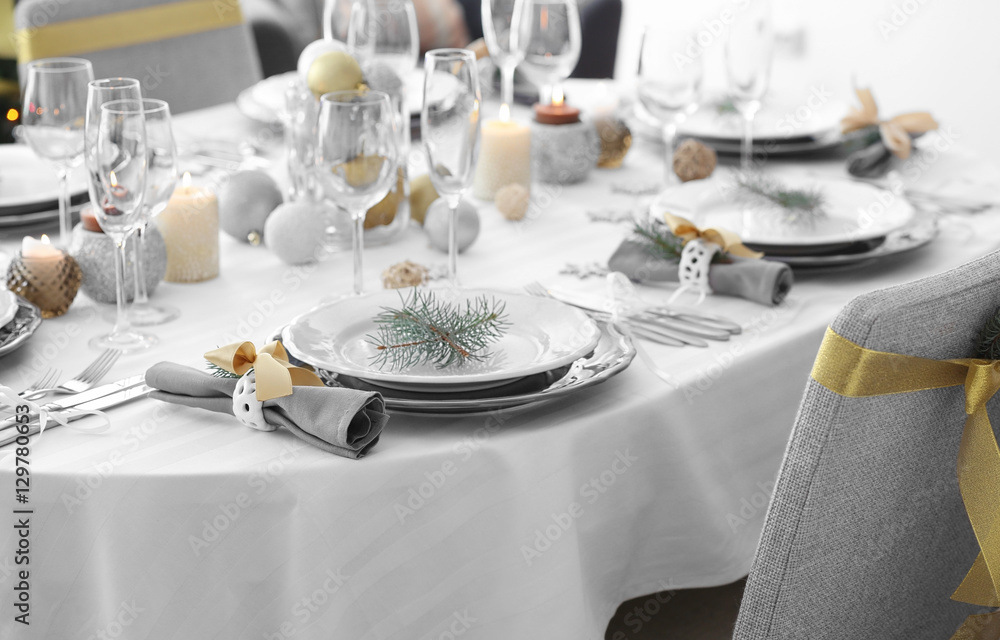 Fototapeta premium Table served for Christmas dinner in living room, close up view