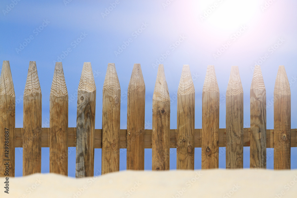 wooden fence on the beach with sunny hotspot wooden fence on the beach with sunny hotspot