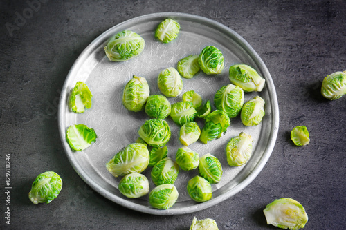 Metal tray with brussels sprouts on table © Africa Studio