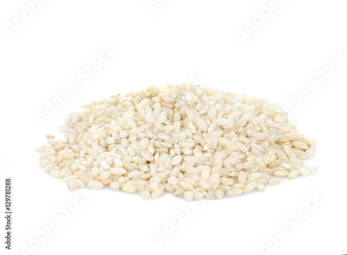 Pile of brown short grain rice isolated on white