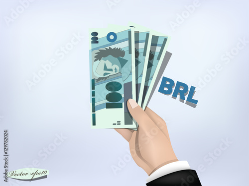 brazilian reals money paper on hand,cash on hand
