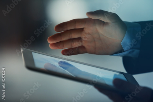 Businessman holding modern tablet, closeup