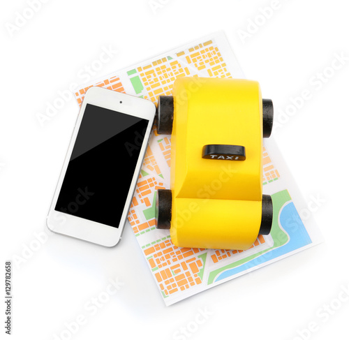 Yellow toy taxi, map and sm...