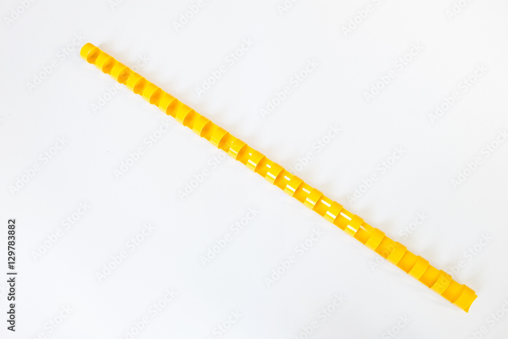 Yellow Plastic Book Binding on white Background Yellow Plastic Book Binding on white Background