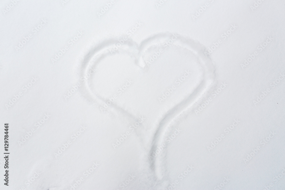 heart shape silhouette or print on snow surface