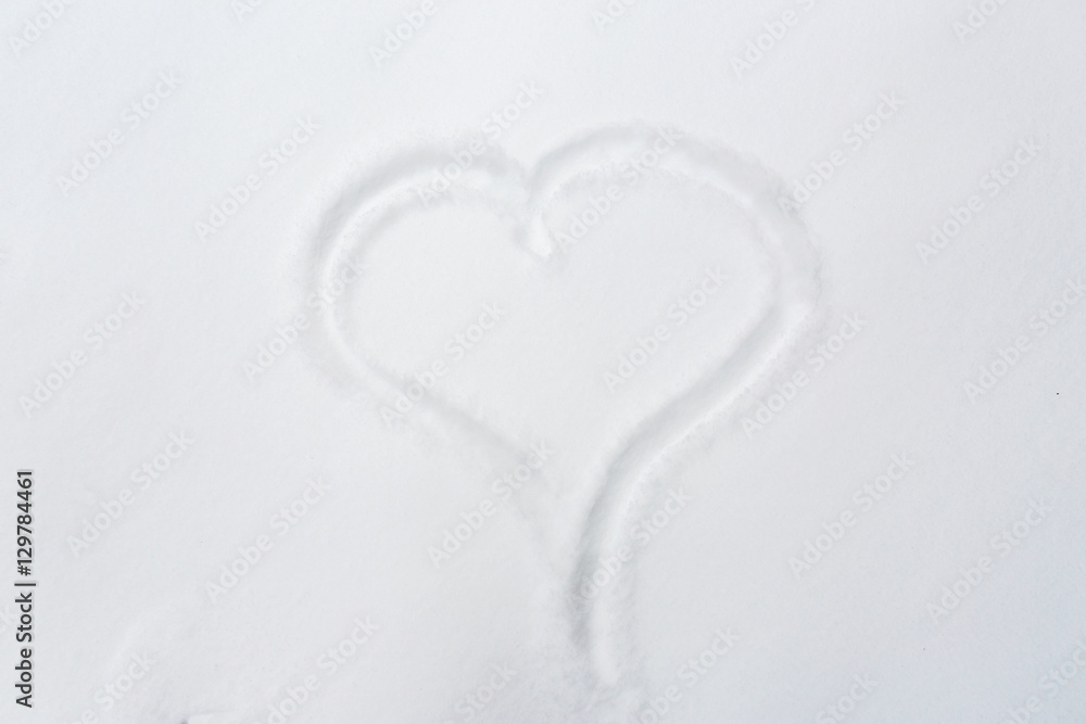 heart shape silhouette or print on snow surface heart shape silhouette or print on snow surface
