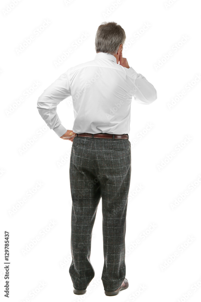 Fototapeta premium Senior businessman standing back on white background