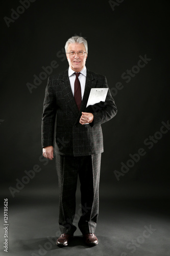 Senior businessman with cli...