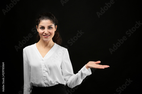 Young businesswoman on blac...