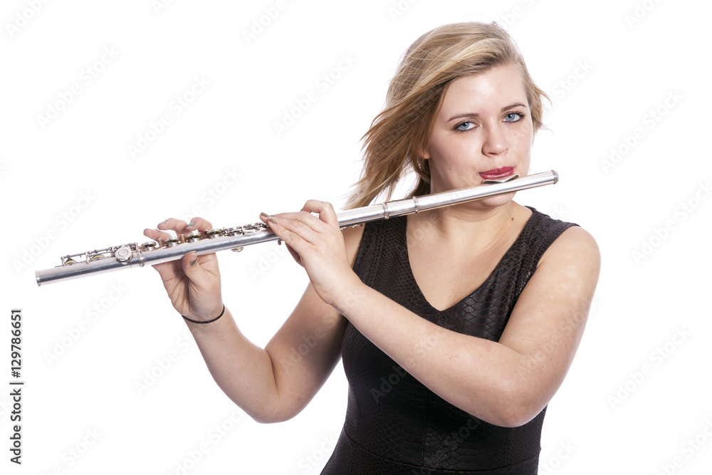 young blond woman plays the flute against white background young blond woman plays the flute against white background