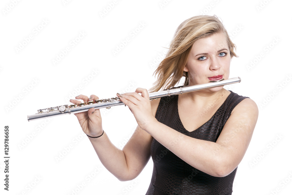 young blond woman plays the flute against white background young blond woman plays the flute against white background