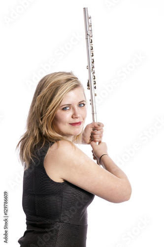 young blond woman and flute against white background