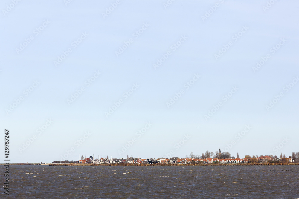 former island of Marken behind markermeer in holland on sunny da