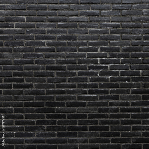 square part of wall consisting of black bricks