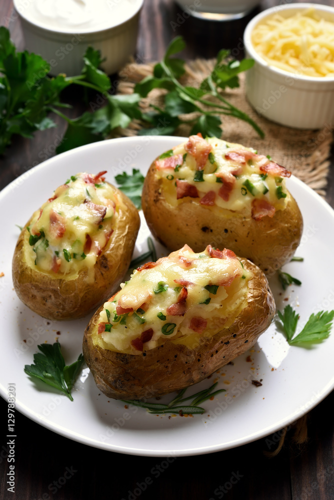 Stuffed potato with bacon, cheese and green onion