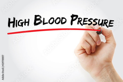 Hand writing High blood pressure with marker, health concept background