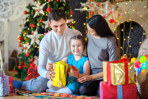 happy family opens gifts