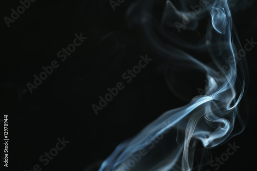 real blue smoke over black background, abstract backdrop