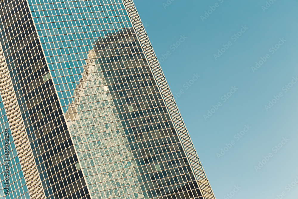Skyscrapers with glass facade. Modern buildings in Paris business district. Concepts of economics, financial, future. Copy space for text. Dynamic composition. Toned Skyscrapers with glass facade. Modern buildings in Paris business district. Concepts of economics, financial, future. Copy space for text. Dynamic composition. Toned