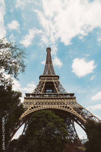 Eiffel Tower. Paris. France. Famous historical landmark on the quay of a river Seine. Romantic, tourist, architecture symbol.