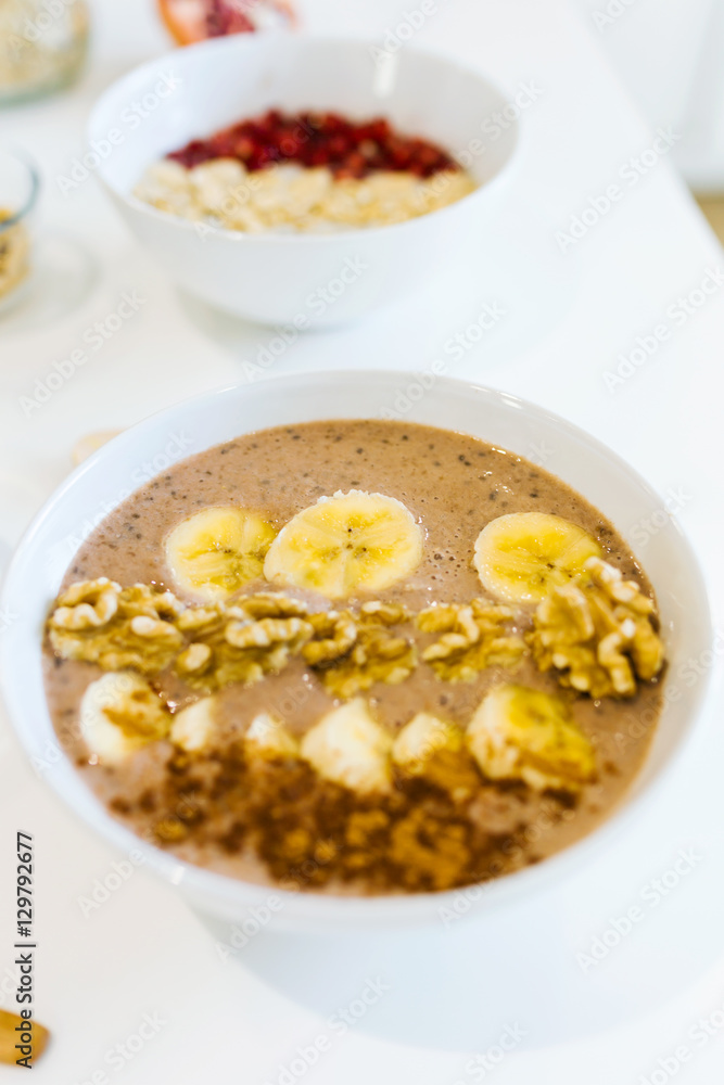Breakfast with milk and oat, nuts, almonds, banana and pomegranate. Breakfast with milk and oat, nuts, almonds, banana and pomegranate.