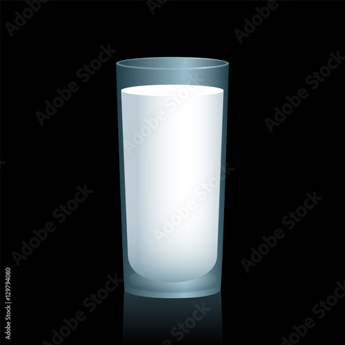 Milk in a glass on black background.