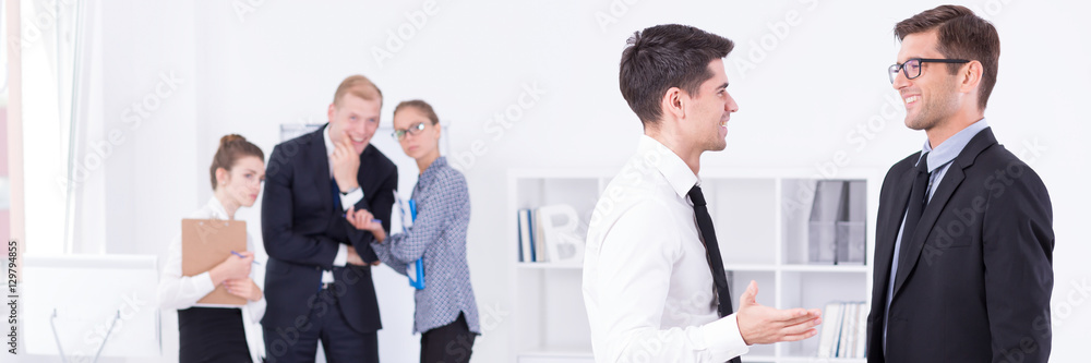 Fototapeta premium Two guys in suits talking