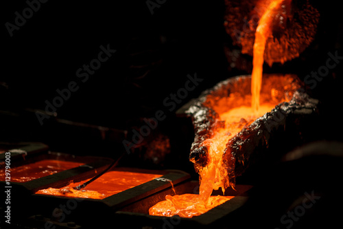 Molten metal at aluminium foundry. Master alloys photo
