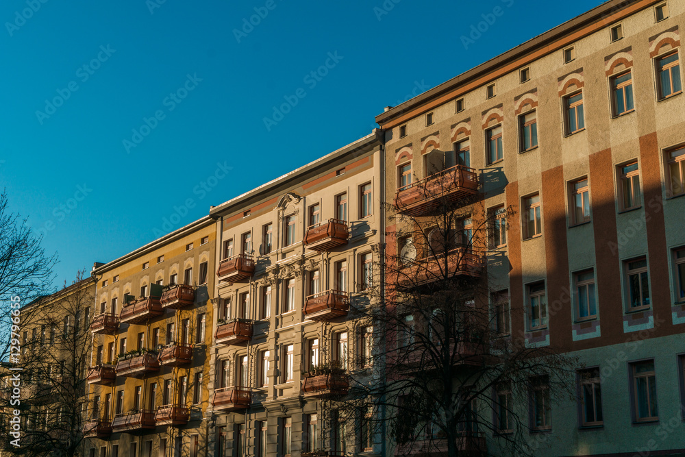 Fototapeta premium row houses at berlin in warm sunlight colors
