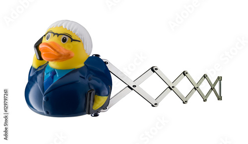 Business man toy rubber duck on scissor spring