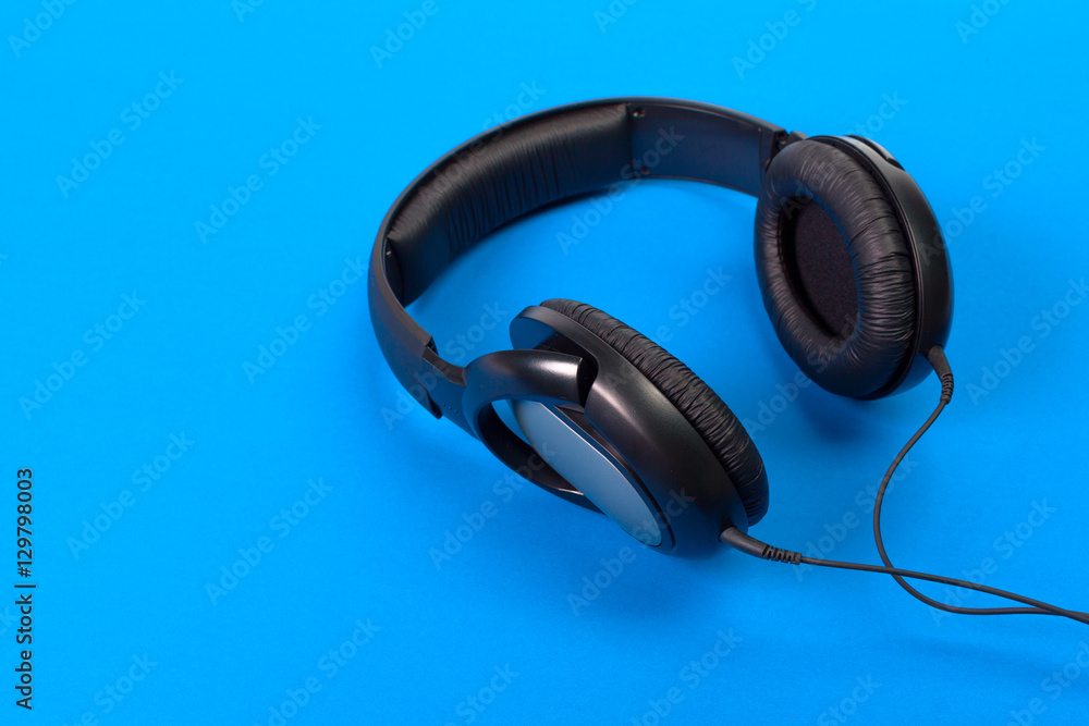 Headphones on blue background Headphones on blue background