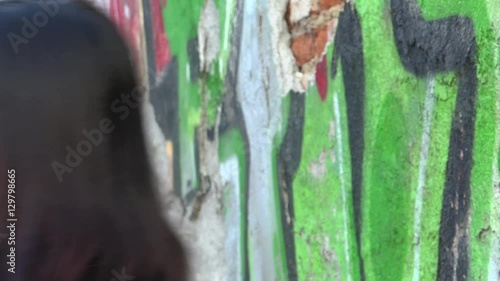 Beautiful young multiracial female can't stop laughing during a film shooting.