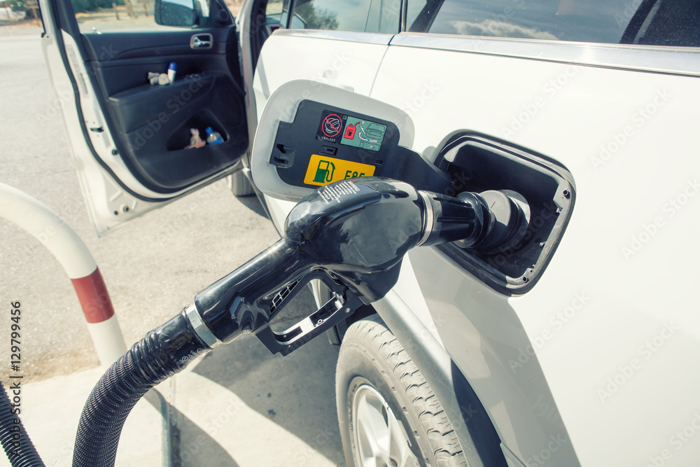 Car refueling on petrol station. To fill the machine with fuel. Car refueling on petrol station. To fill the machine with fuel.