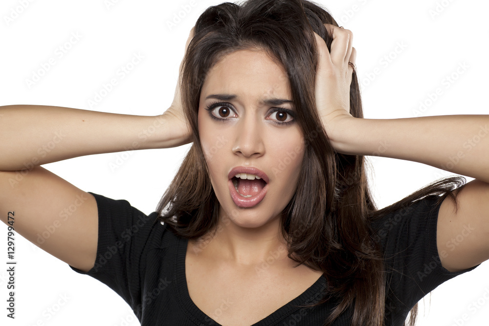 shocked young woman on a white background