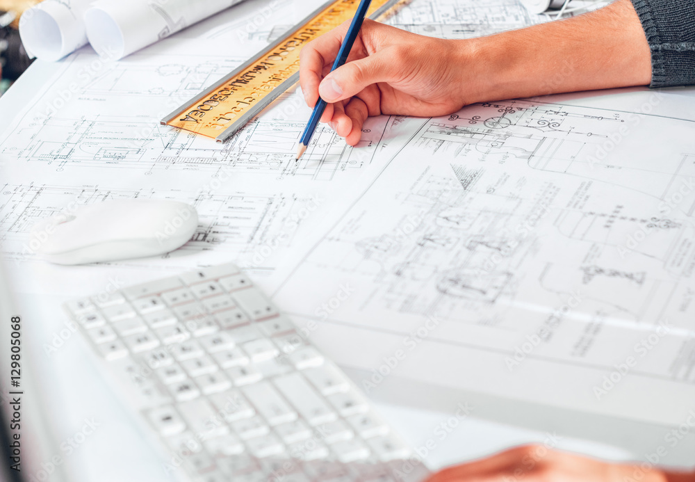 Hands of Engineer drawing on architectural project. Freelance work.
Selective focus. Hands of Engineer drawing on architectural project. Freelance work.
Selective focus.