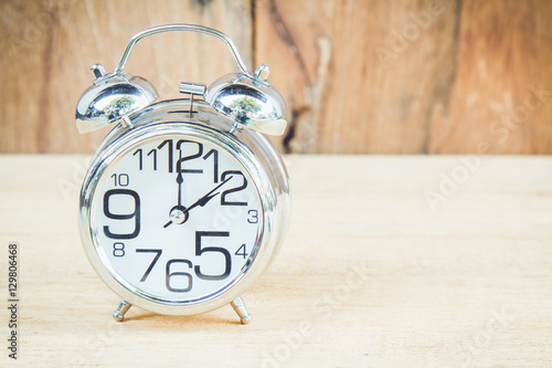 Clock on wood background