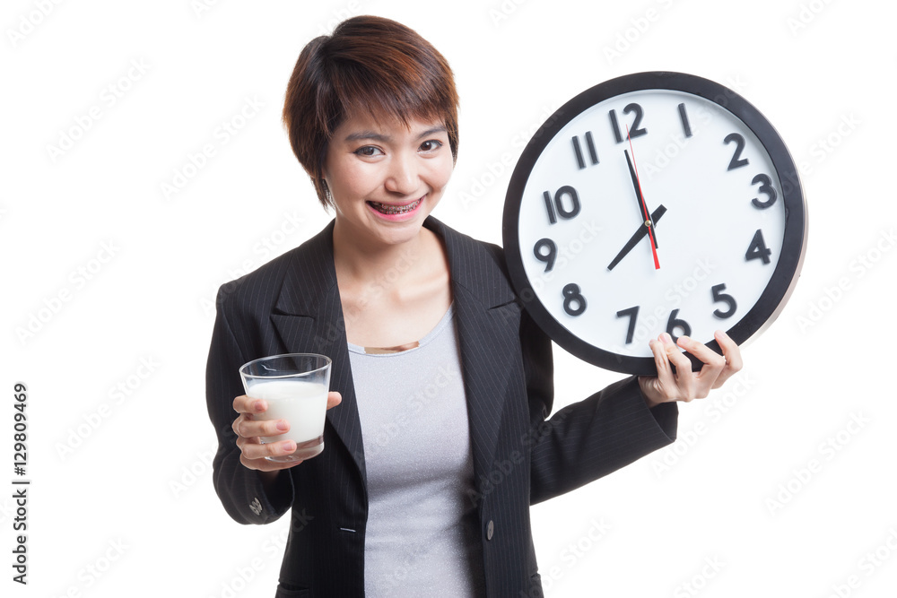 Healthy Asian woman drinking glass of milk hold clock. Healthy Asian woman drinking glass of milk hold clock.