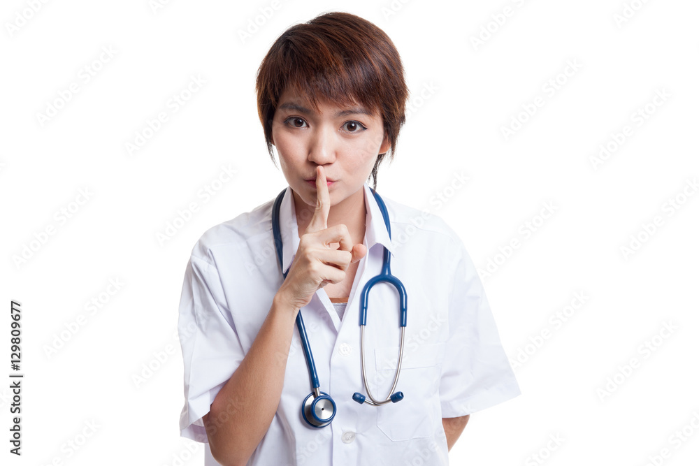 Asian young female doctor do quiet sign. Asian young female doctor do quiet sign.