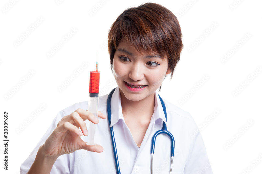 Young Asian female doctor smile hold syringe. Young Asian female doctor smile hold syringe.