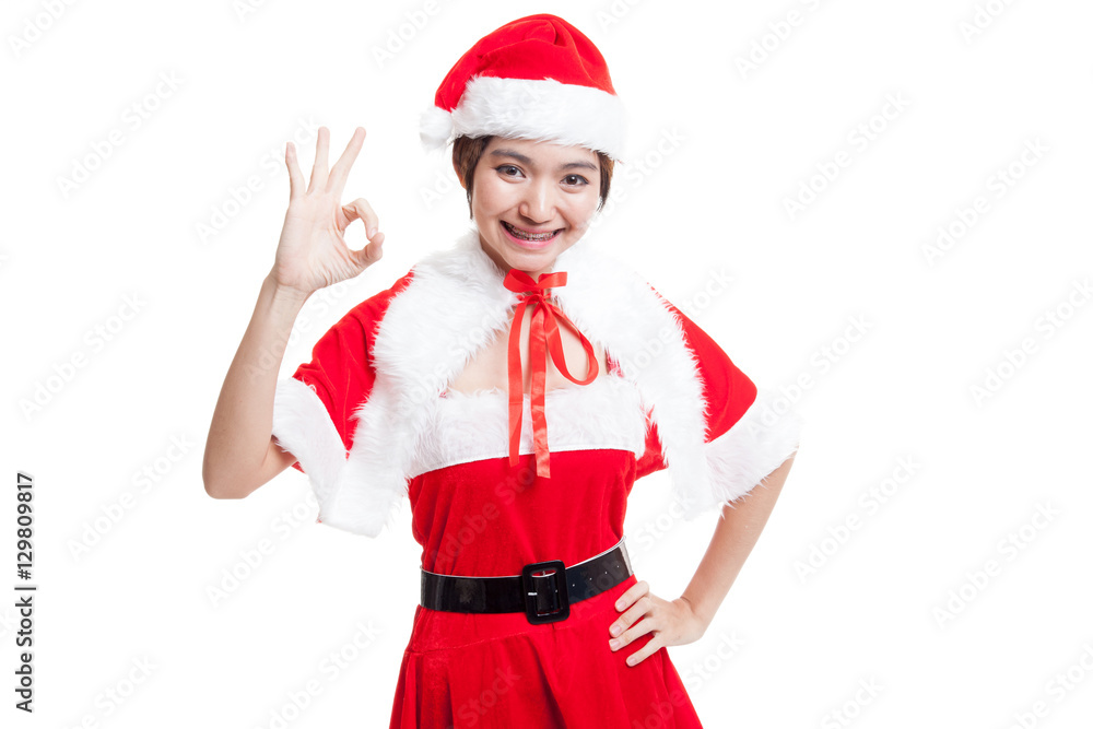 Asian Christmas Santa Claus girl show Ok sign. Asian Christmas Santa Claus girl show Ok sign.